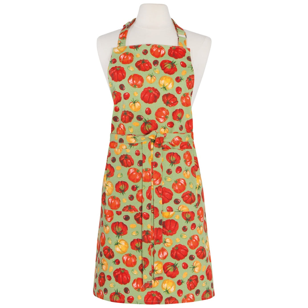 green apron with red and yellow heirloom tomatoes on it