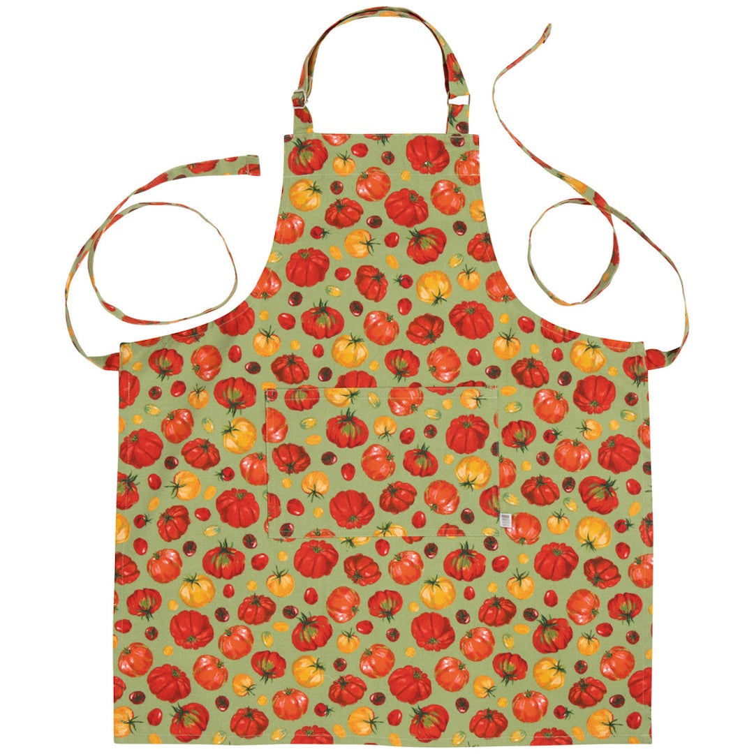 green apron with red and yellow heirloom tomatoes on it