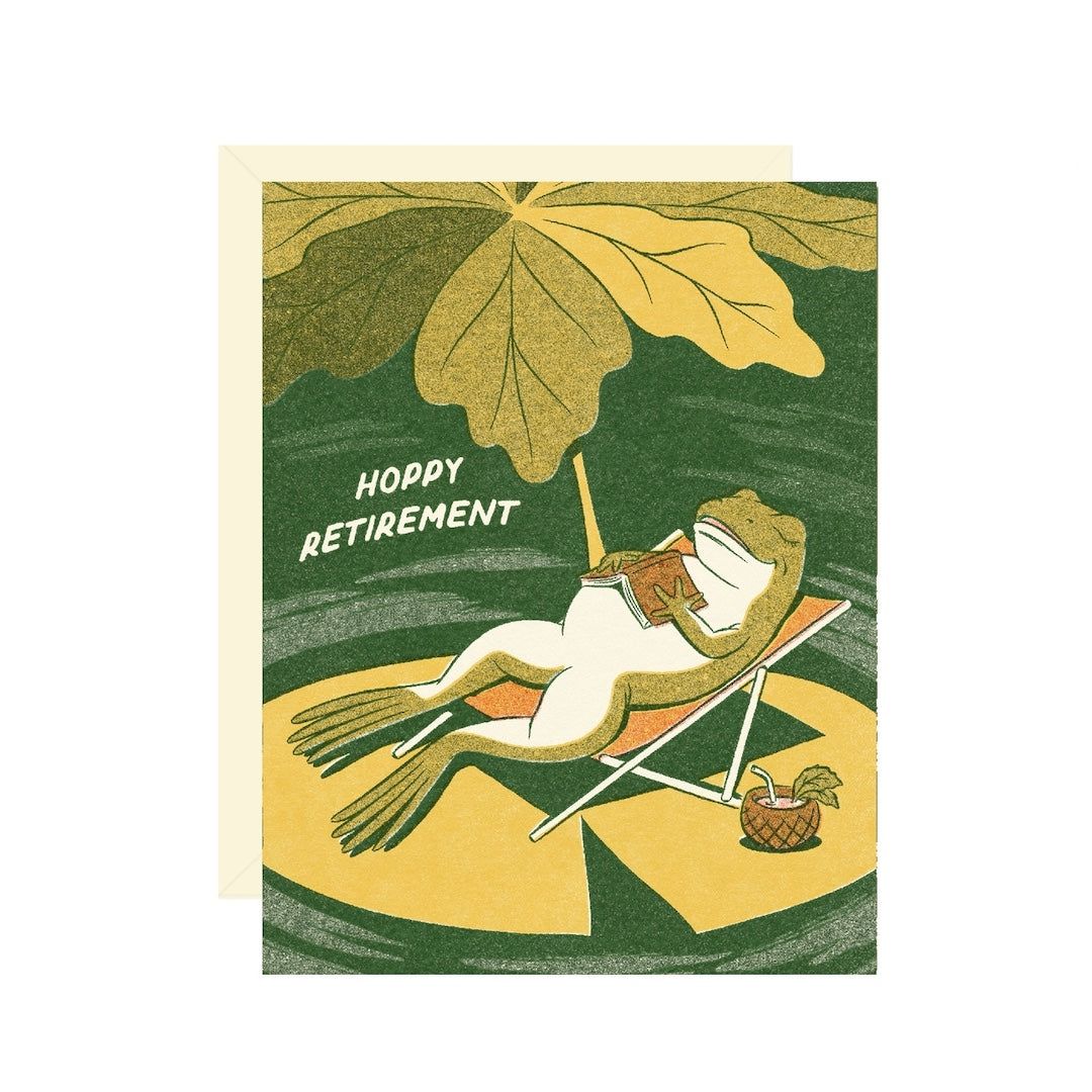 Greeting card with a frog on a lounge chair under a leaf, text 'Hoppy Retirement'.
