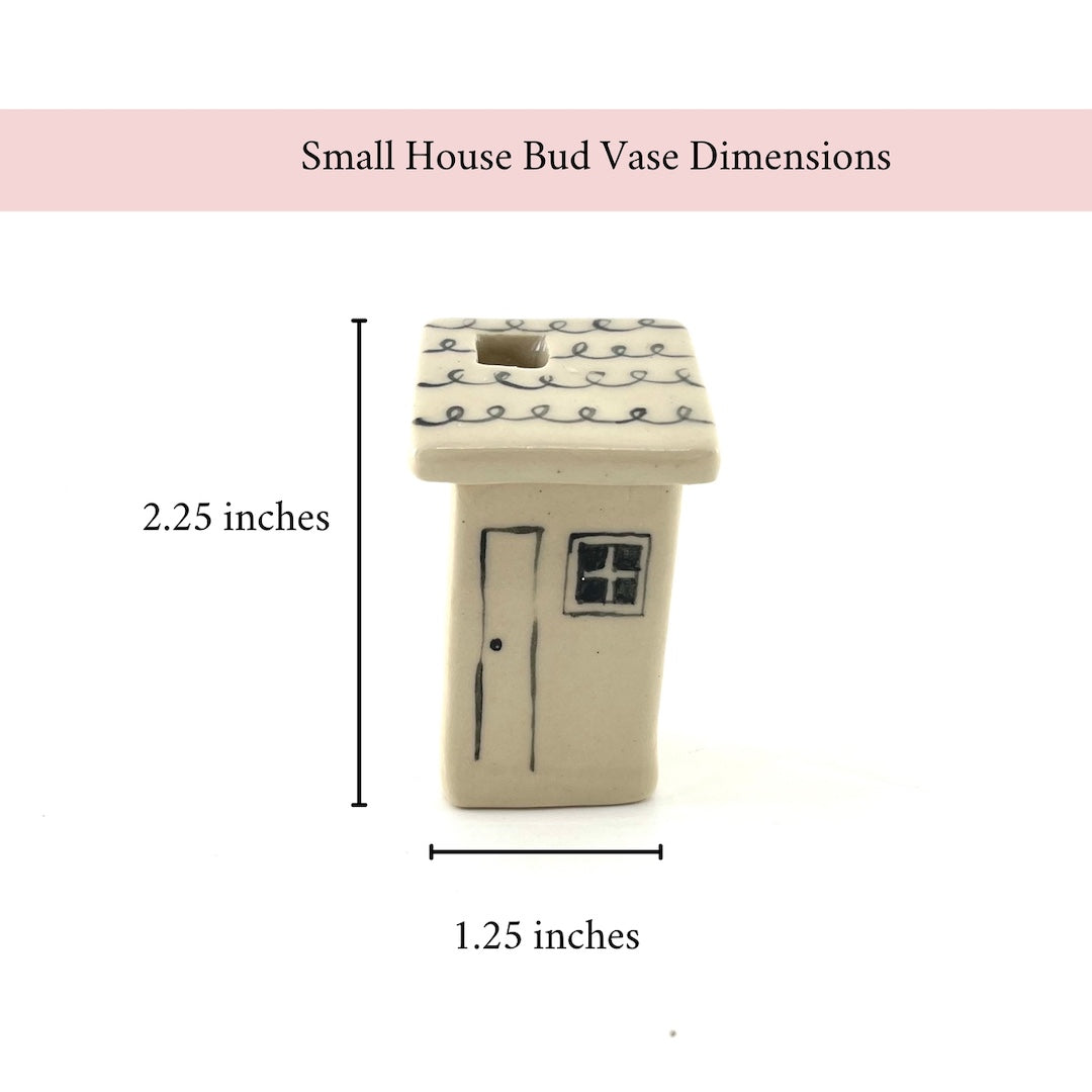 Small house-shaped bud vase with dimensions on a white background