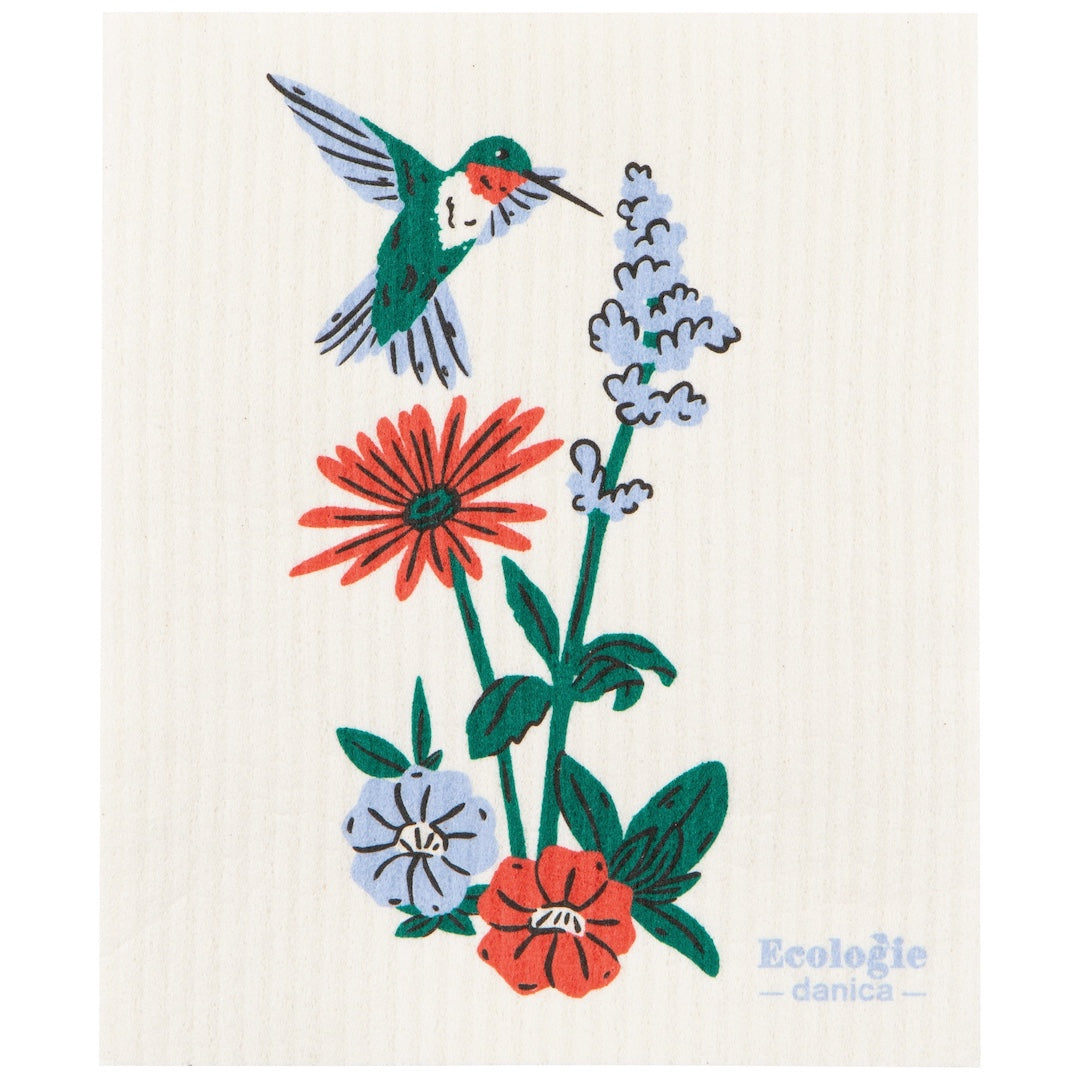white swedish dish cloth with a hummingird and floral design on it