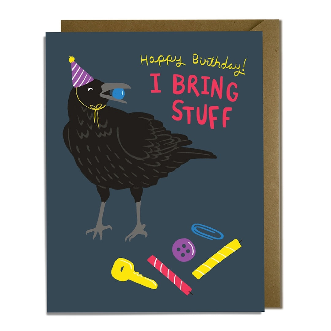 Birthday card with a crow illustration and text "happy birthday! I bring stuff" on a dark blue background.