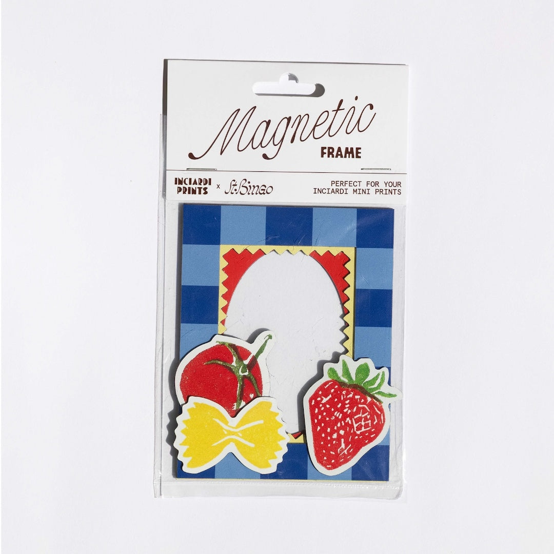 Magnetic frame packaging with illustrations of a bow tie, tomato, and strawberry on a blue checkered background.