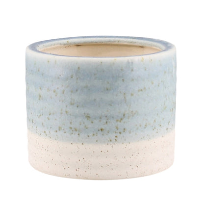A small cylindrical ceramic planter with a two-tone glaze, featuring a light blue upper section and a speckled off-white lower section, shown on a plain white background.