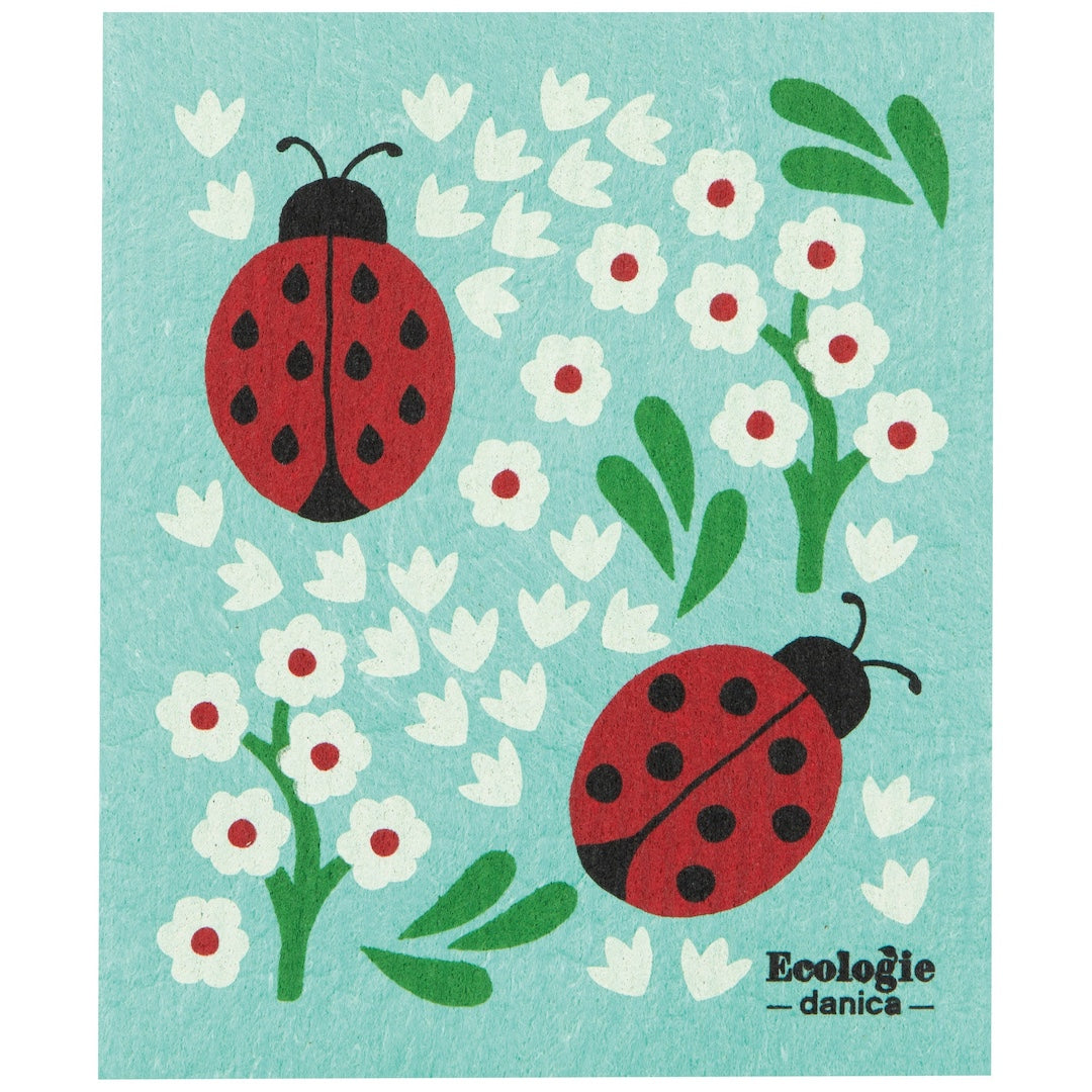 blue swedish dishcloth with a lady bug and floral design on it
