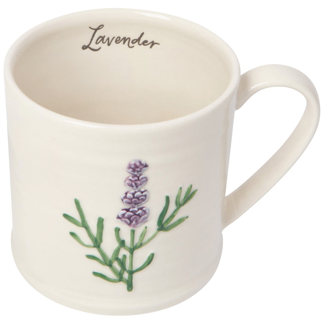 white mug with a sprig of lavender on the front. Inside the mug the word "lavender" is written in cursive