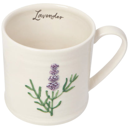 white mug with a sprig of lavender on the front. Inside the mug the word "lavender" is written in cursive