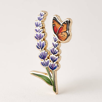 Brooch with butterfly on lavender flowers on a white background