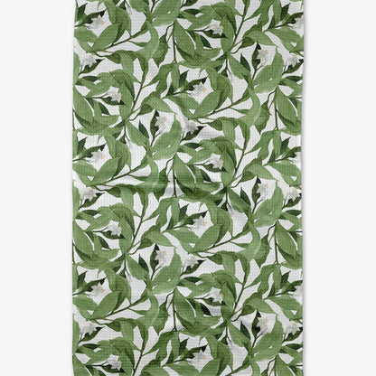 dishtowel with a green leaf pattern on a white background