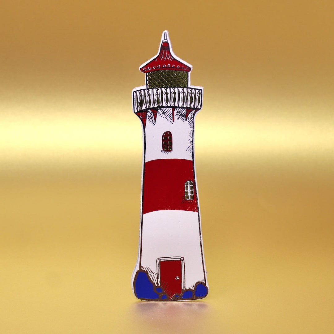 Lighthouse-shaped leather bookmark with red, white, and blue colors on a gold background