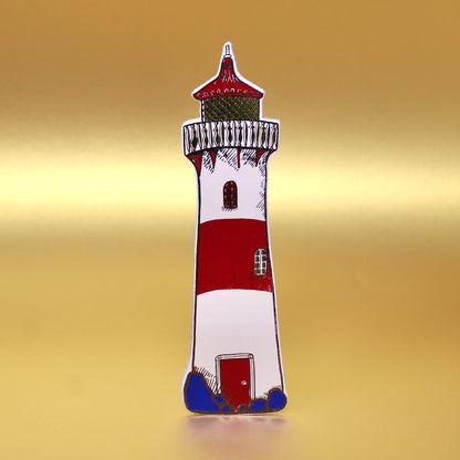 Lighthouse-shaped leather bookmark with red, white, and blue colors on a gold background