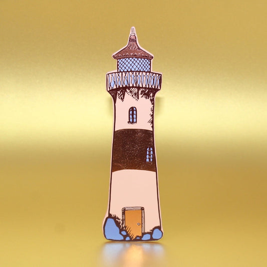 Lighthouse-shaped leather bookmark on a yellow background