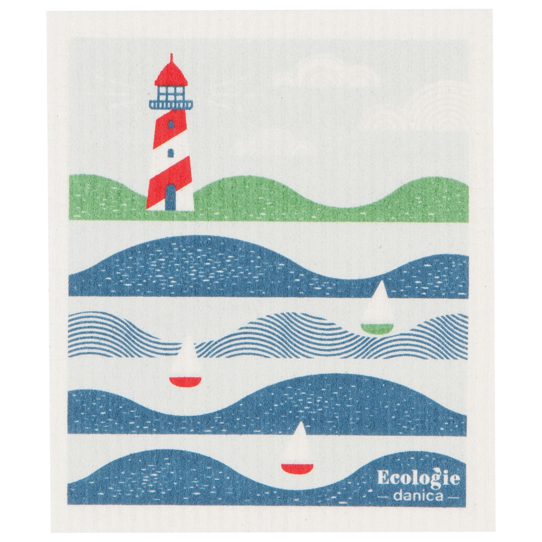 swedish dishcloth with a lighthouse and ocean scene on it