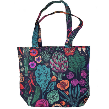 A canvas tote bag featuring a vibrant, multicolored botanical and mushroom print on a dark navy background, shown against a plain white background.