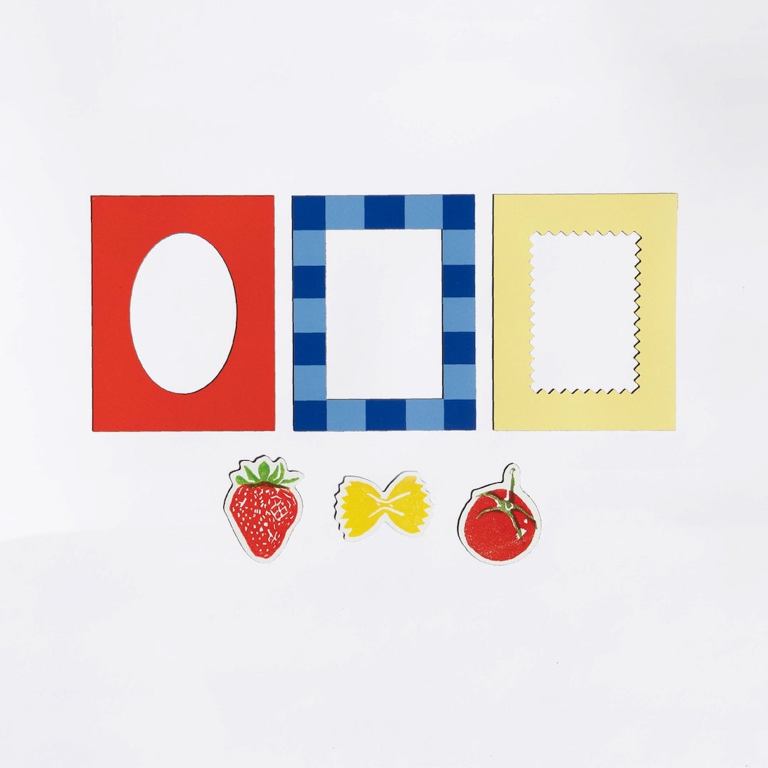 Three colorful magnetic frames and three small food themed magnets on a white background