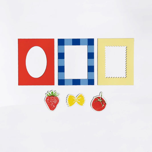 Three colorful magnetic frames and three small food themed magnets on a white background