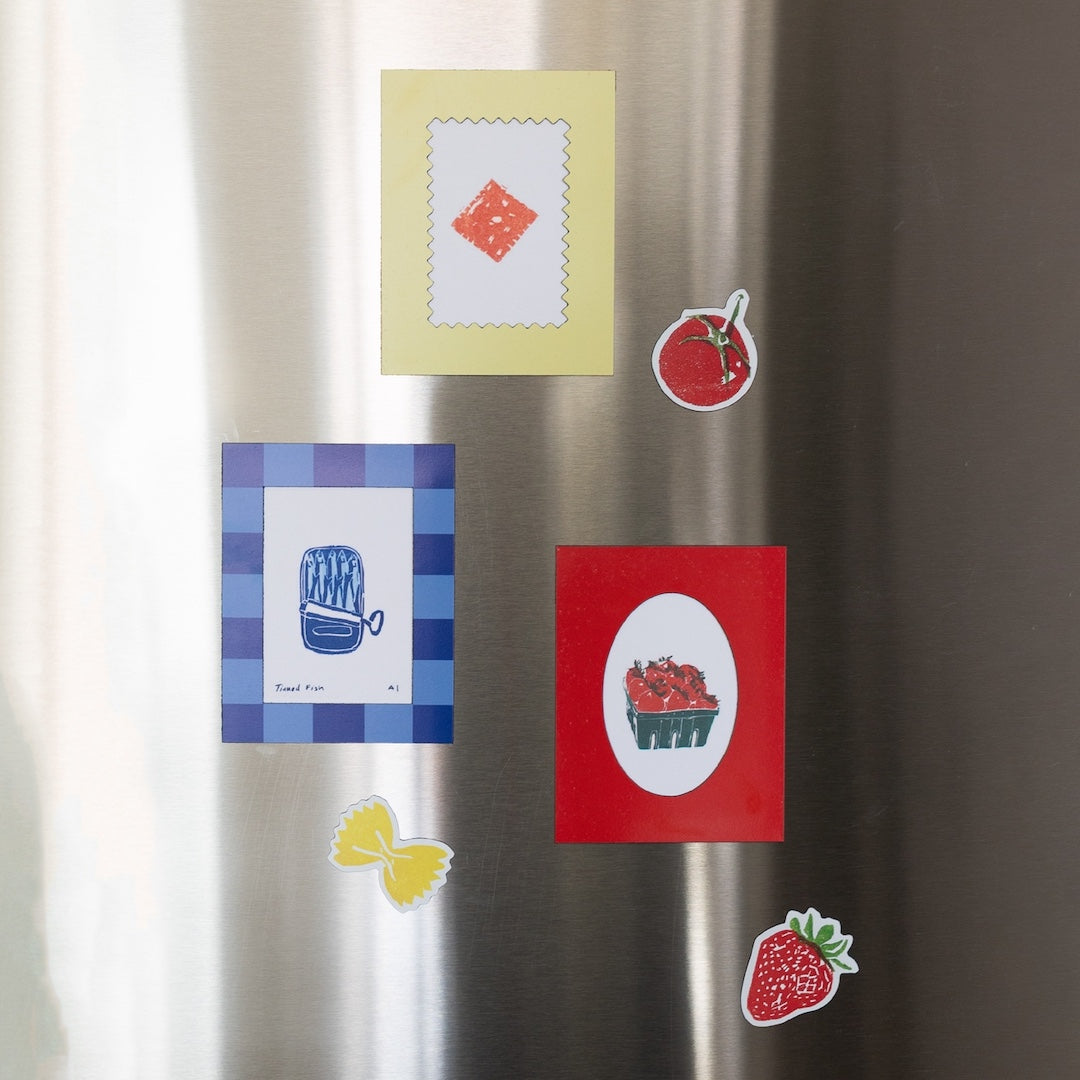 Colorful refrigerator magnets on a metallic surface