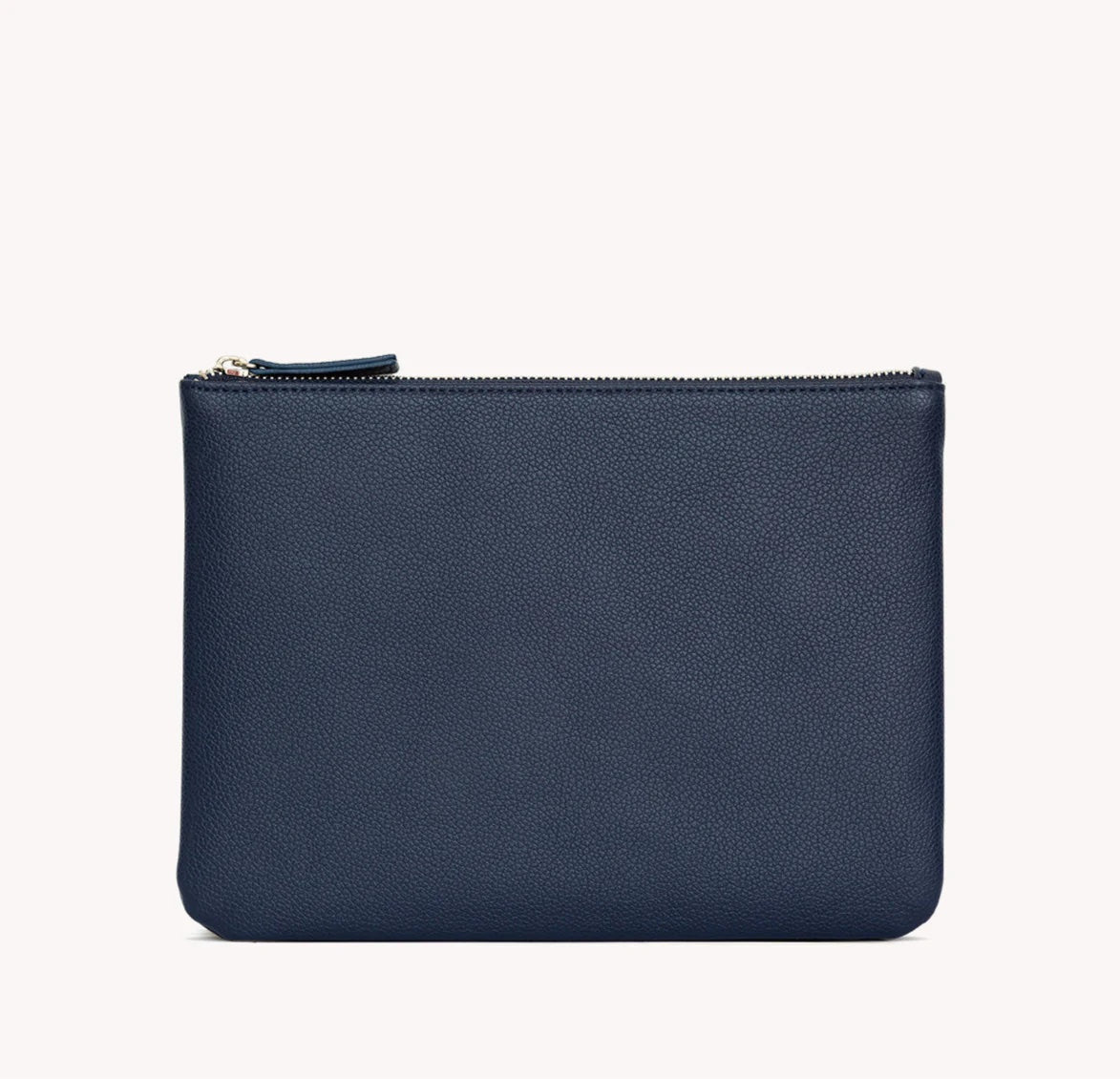 A navy blue vegan leather zip pouch with a silver zipper pull, shown against a plain off-white background.