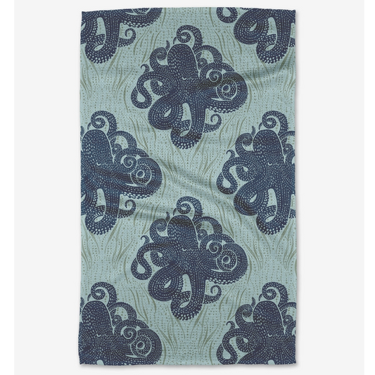Teal towel with navy blue octopus pattern on a white background