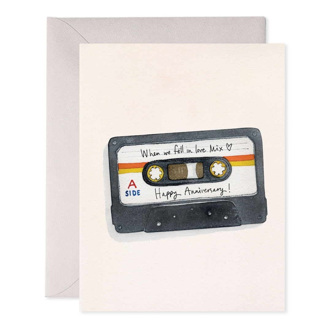 Greeting card with a cassette tape that has "when we fell in love mix. Happy Anniversary" written on it 