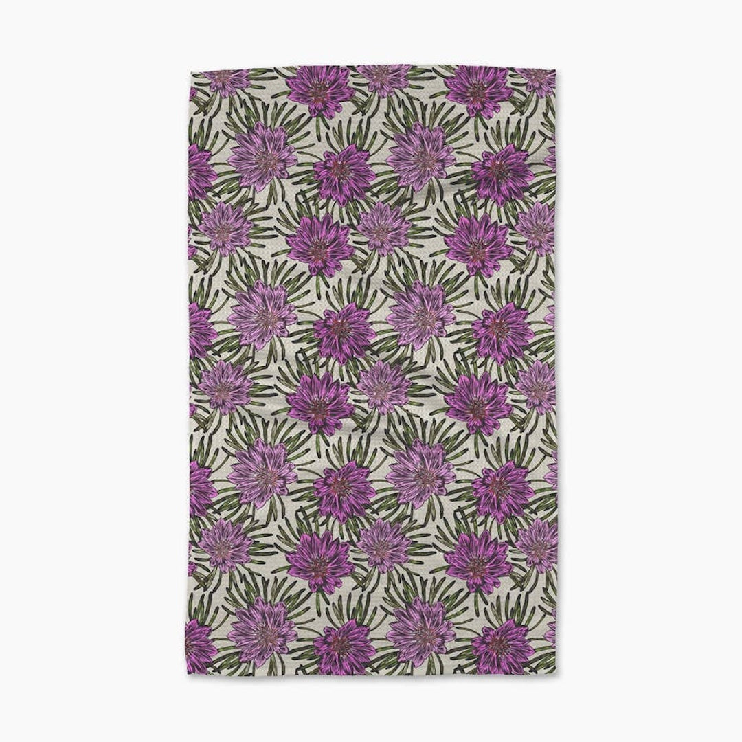 Towel with purple floral pattern on a white background