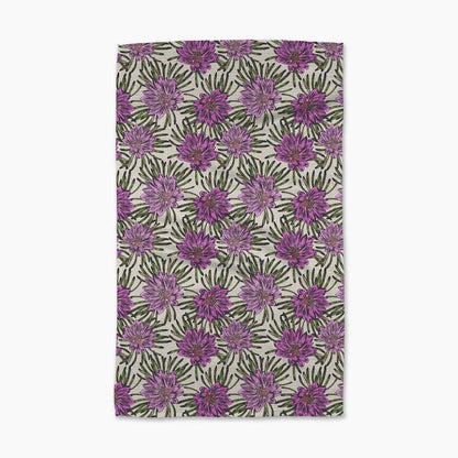 Towel with purple floral pattern on a white background