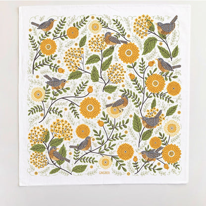Patterned towel with birds and mums flowers on a white background