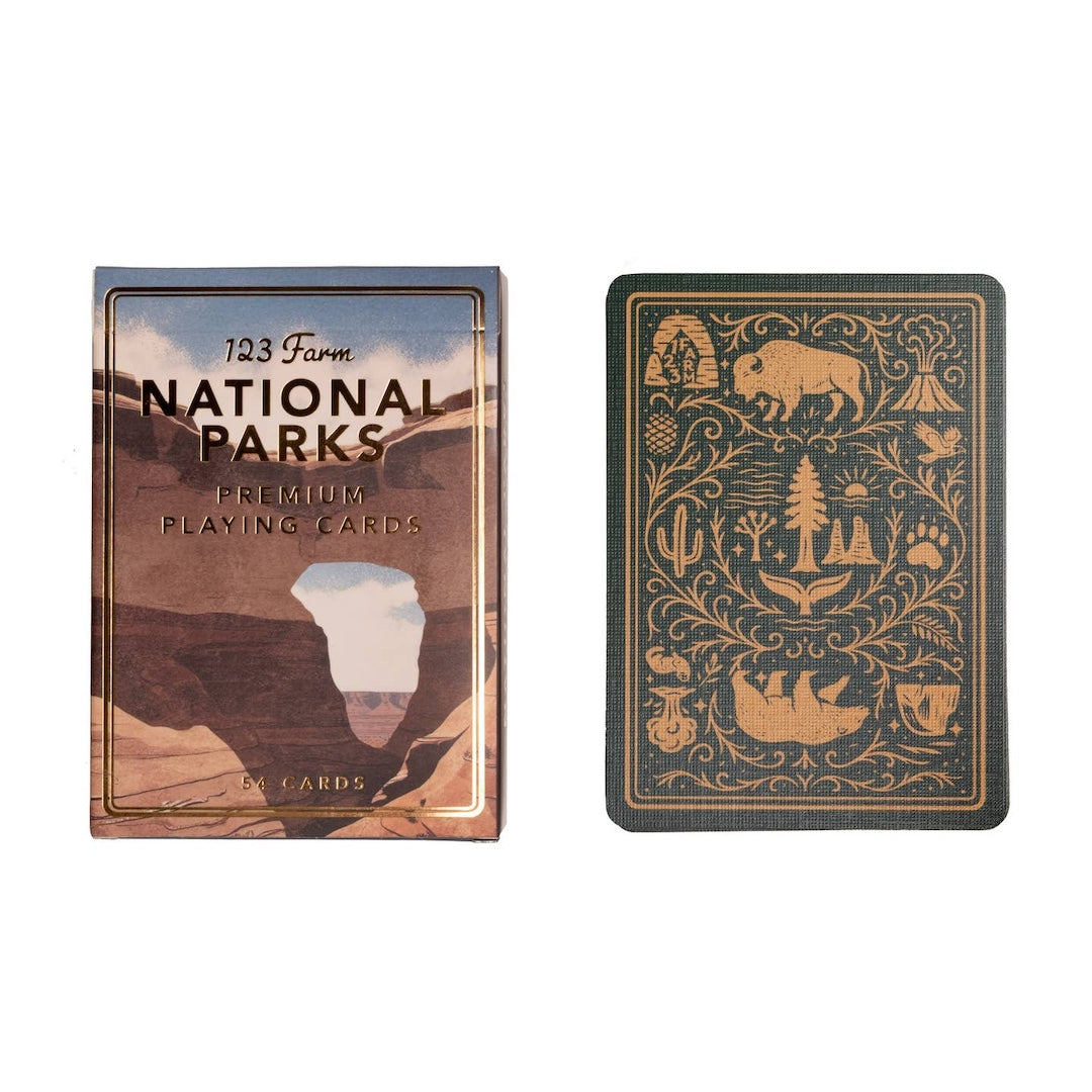 National Parks playing cards with one card showing a design of a bear and nature symbols.