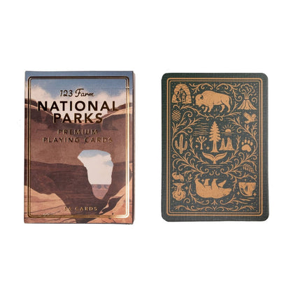 National Parks playing cards with one card showing a design of a bear and nature symbols.