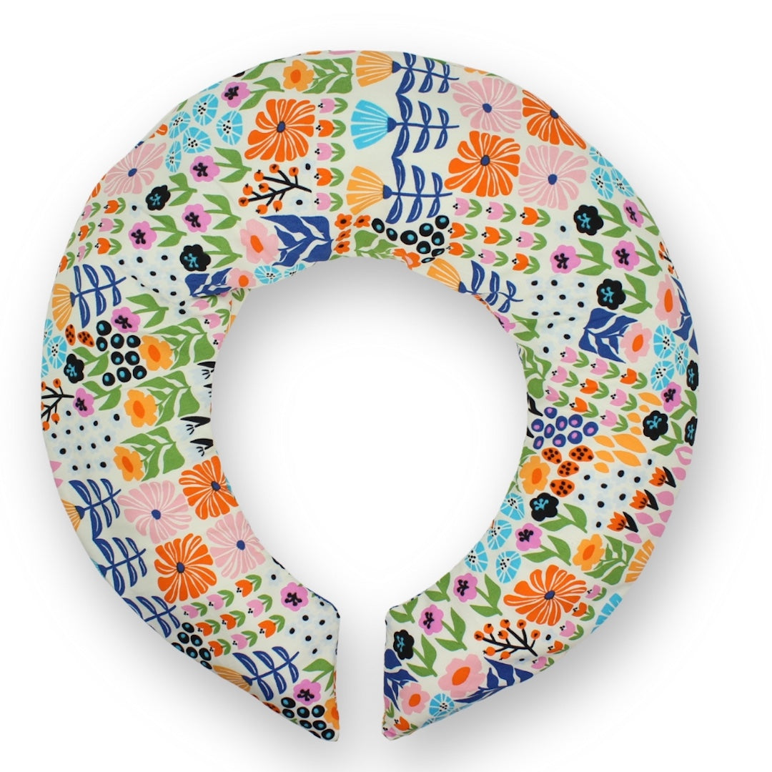 Colorful floral-patterned neck pillow on a white background