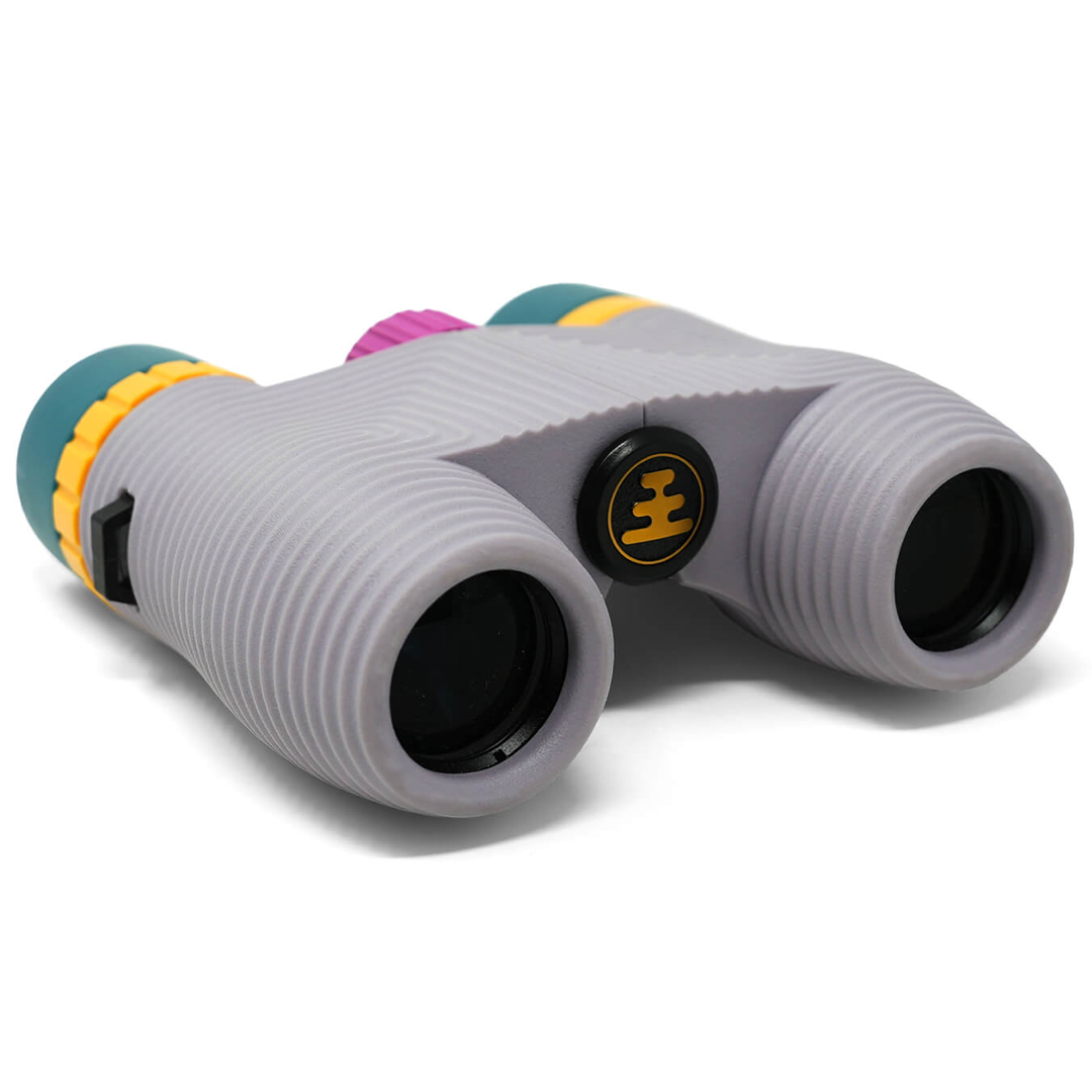 Light purple binoculars on a white background