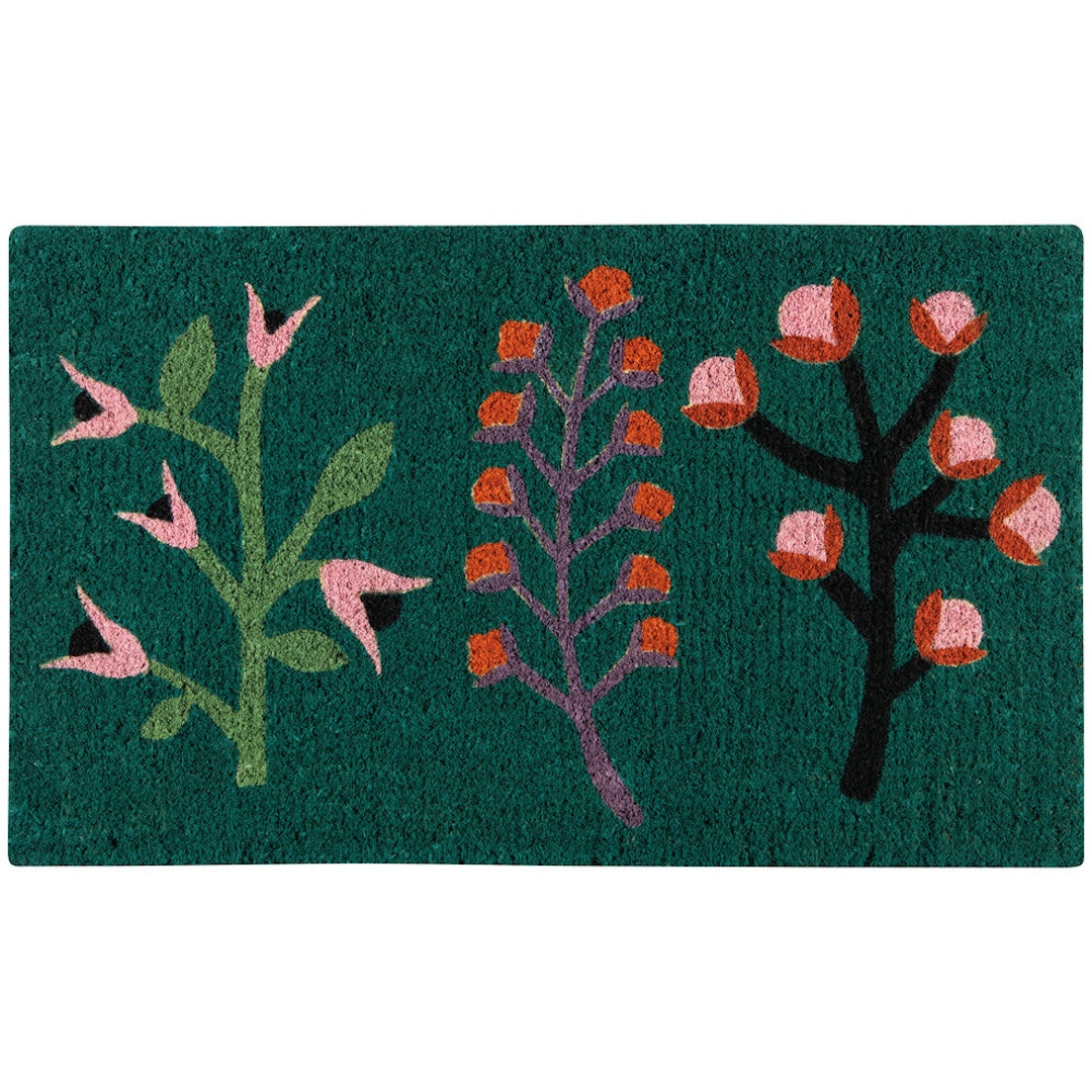 Decorative doormat with floral designs on a green background