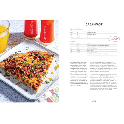 A printed recipe for breakfast pizza shown beside a plated food photo. The left side features a close-up of a pizza topped with melted cheese, onions, and cilantro on a white plate, with two red drink containers behind it.