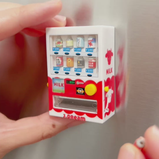 Video showing someone loading a small fake soda into a vending machine magnet then the person shows how you press the button to vend the soda from the machine