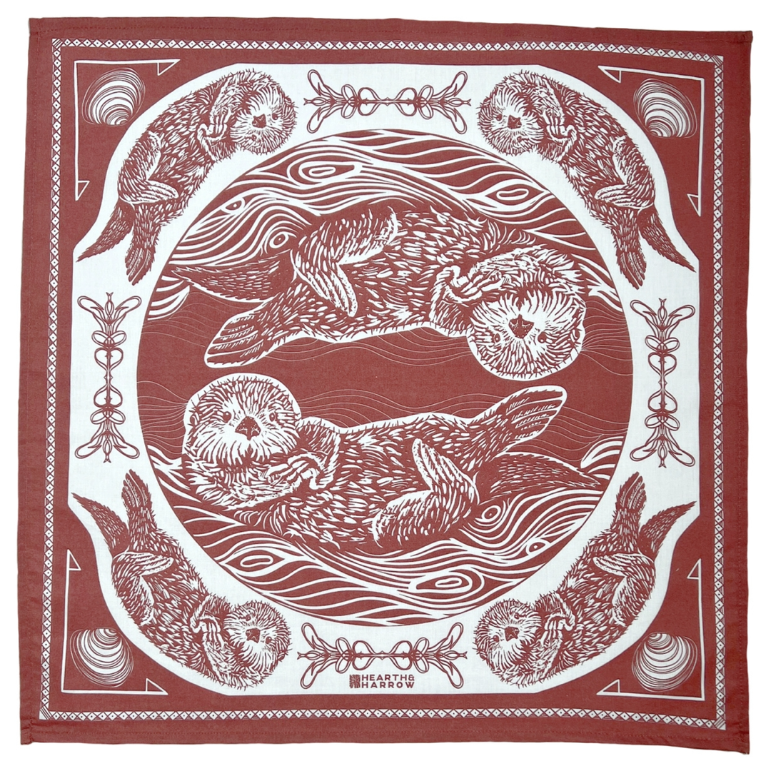 Red and white bandana with otter design and decorative border