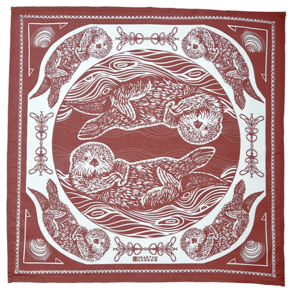 Red and white bandana with otter design and decorative border