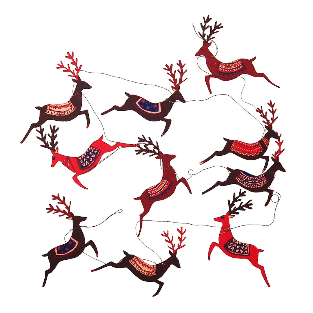 A garland featuring multiple stylized reindeer in red, dark brown, and black with patterned blankets, arranged on a plain white background.