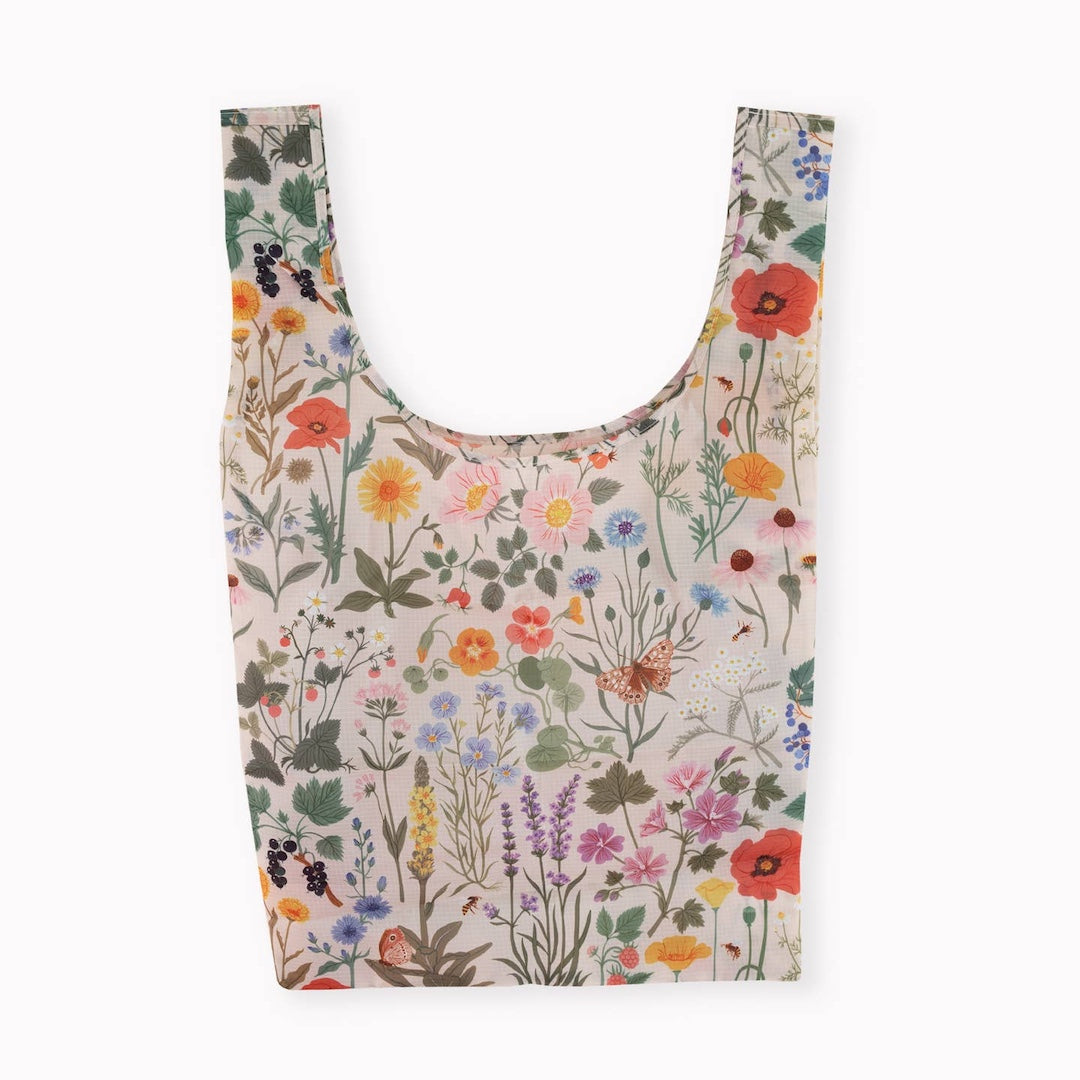 White reusable shopping bag with floral pattern on a white background