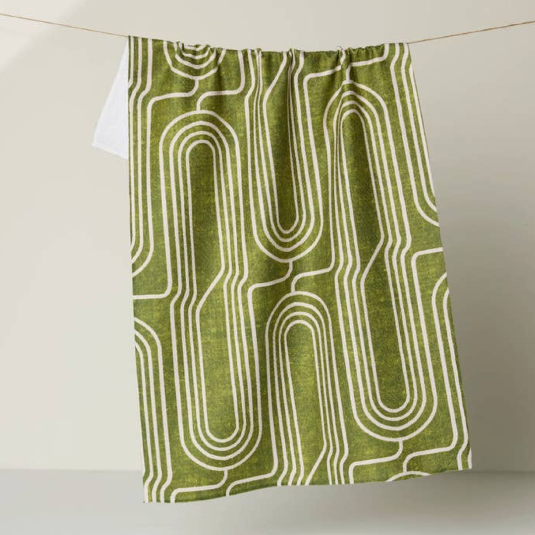 green dishtowel with an abstract pattern