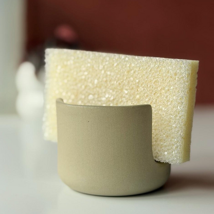 Sponge in a sage green ceramic sponge holder