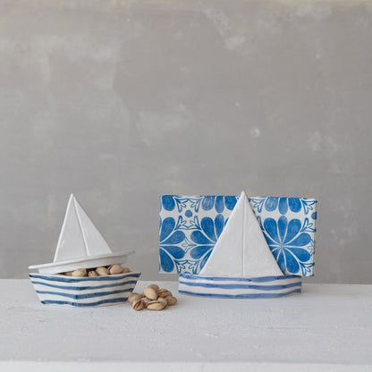 sailboat shaped napkin holder holding napkins