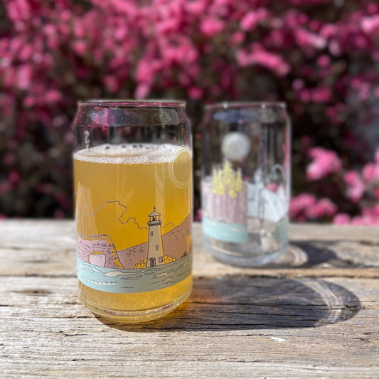 Two glasses with a colorful illustration of Santa Cruz landmarks. 