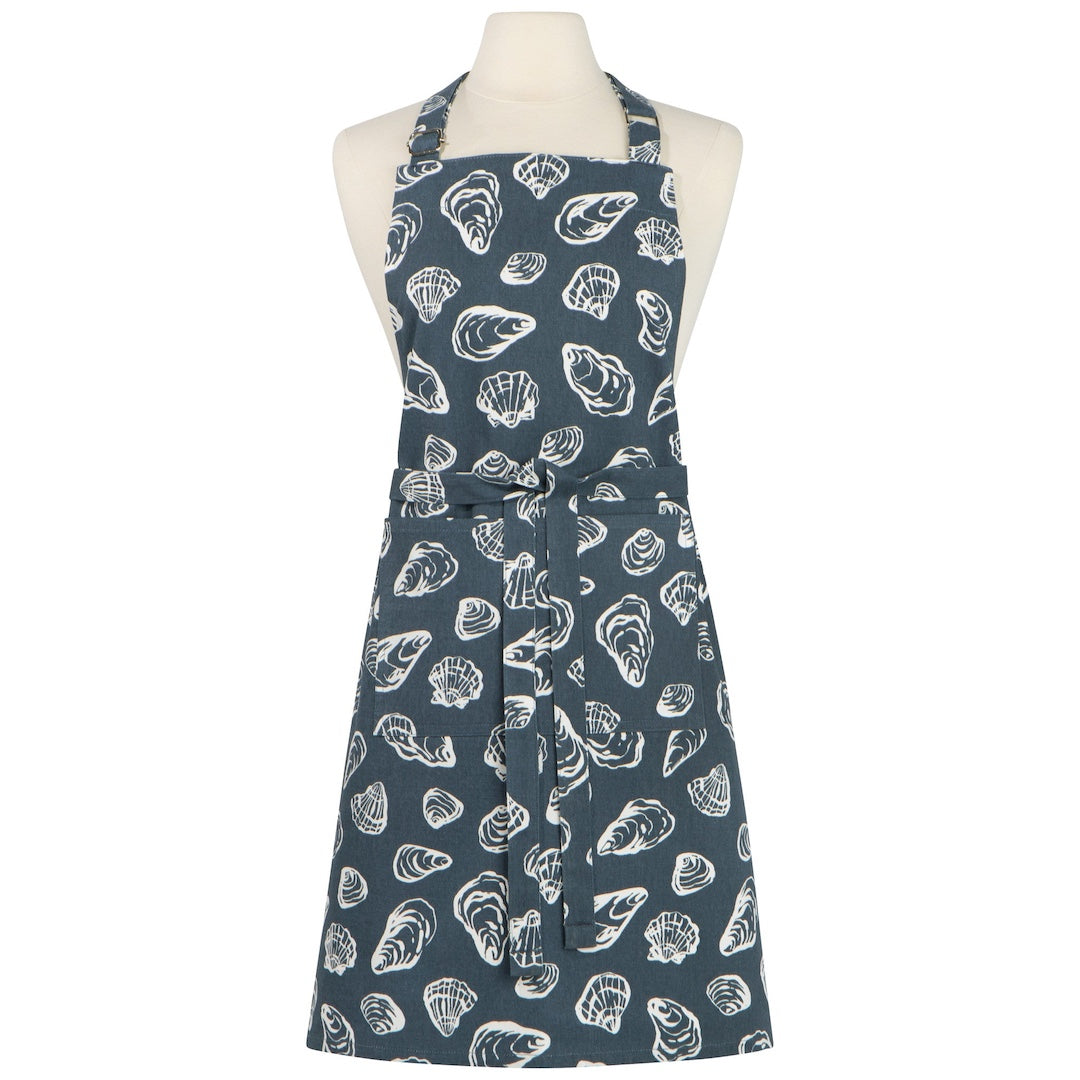 Blue apron with white shell pattern on a mannequin against a white background