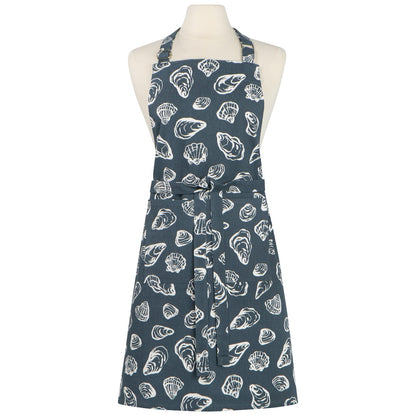 Blue apron with white shell pattern on a mannequin against a white background