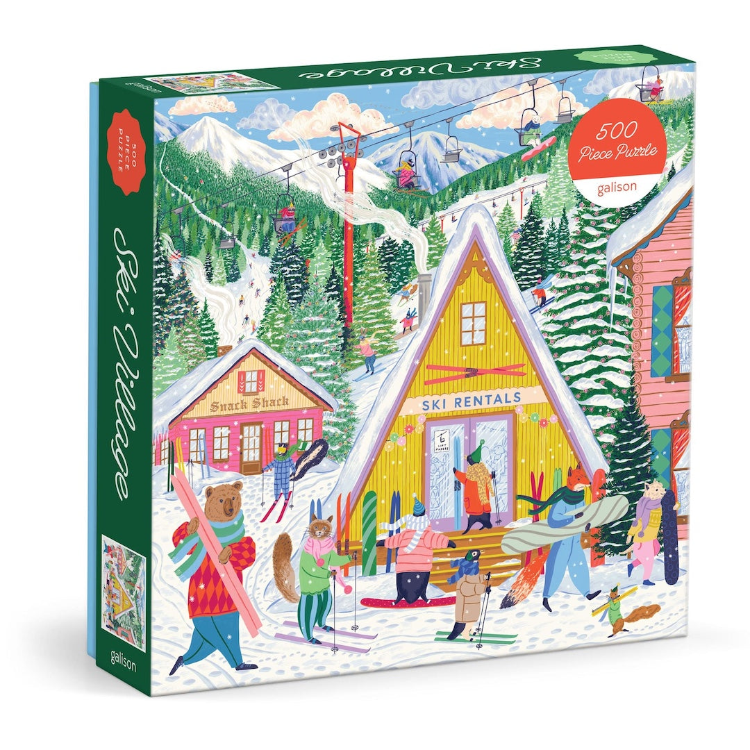 A 500-piece jigsaw puzzle box by Galison titled ' ski Village'. The box features a colorful, whimsical winter illustration of a ski resort with people, animals, chalets, and skiers.