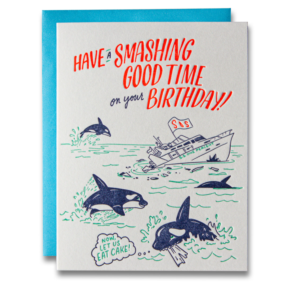 A birthday card with a bright blue envelope, featuring a humorous illustration of orcas jumping out of the water with the text 'HAVE A SMASHING GOOD TIME on your BIRTHDAY!'.