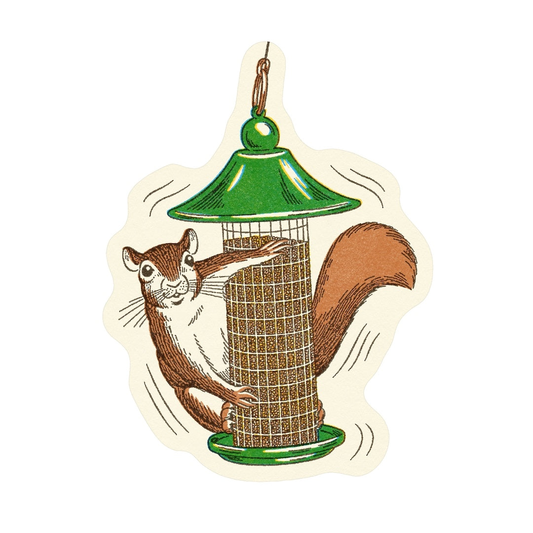 A die-cut sticker featuring a cartoon squirrel clinging to a green bird feeder, shown on a plain white background.