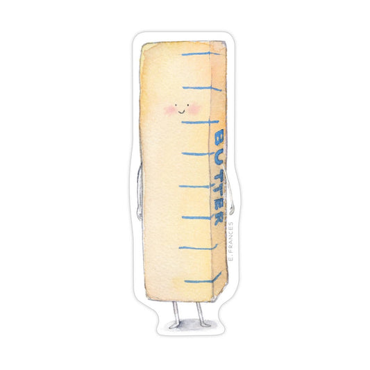Butter stick with a face sticker on a white background