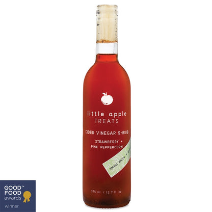 Bottle of 'little apple Treats' cider vinegar shrub with strawberry and pink peppercorn flavor on a white background.