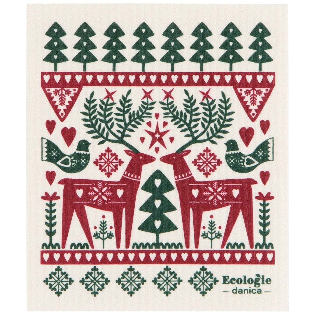 A white swedish dishcloth featuring a Christmas-themed pattern with red reindeer, green trees, birds, hearts, and snowflakes on it. The text 'Ecologie - danica' appears in the lower right corner.